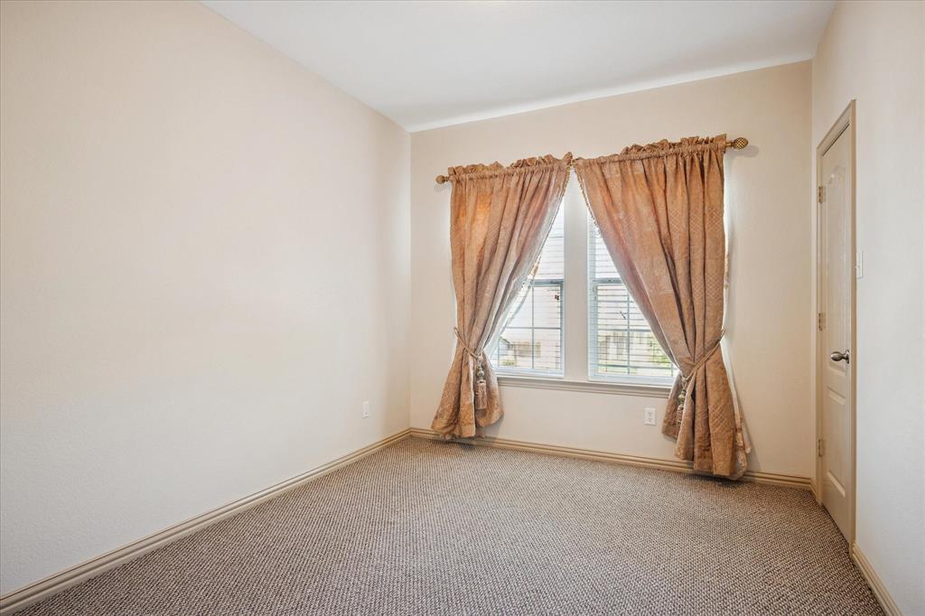 3808 Vienna Street Irving, TX 75038 - Photo 13 of 22 an empty room with windows