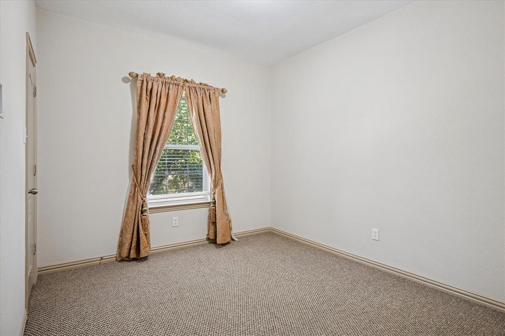 3808 Vienna Street Irving, TX 75038 - Photo 15 of 22 an empty room with a window