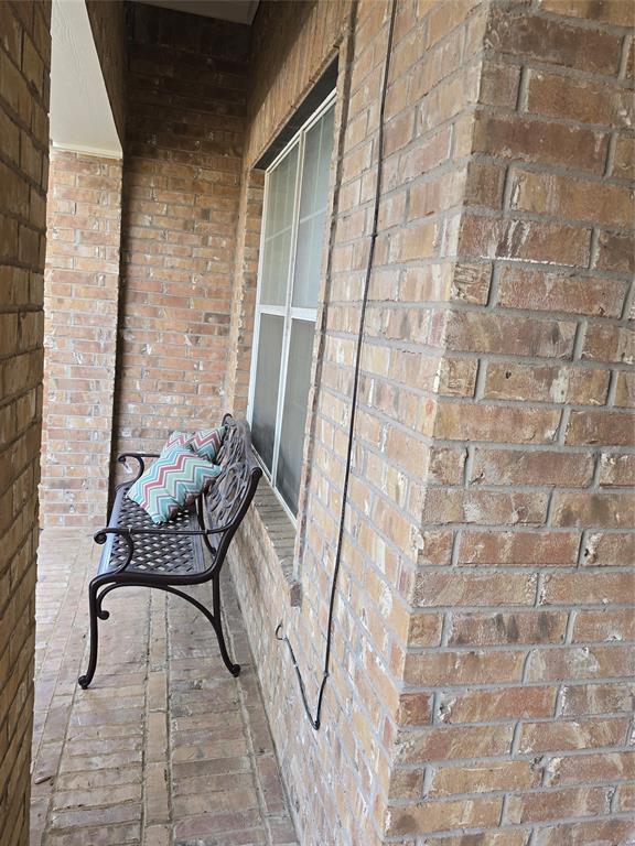 3808 Vienna Street Irving, TX 75038 - Photo 2 of 22 a balcony with a couch and a table