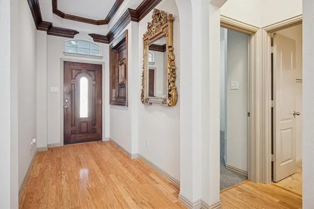 a bedroom with a bed and a mirror