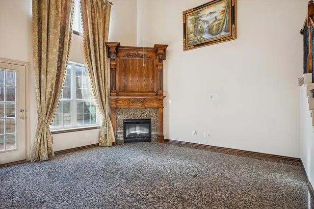 a view of empty room with floor to ceiling window