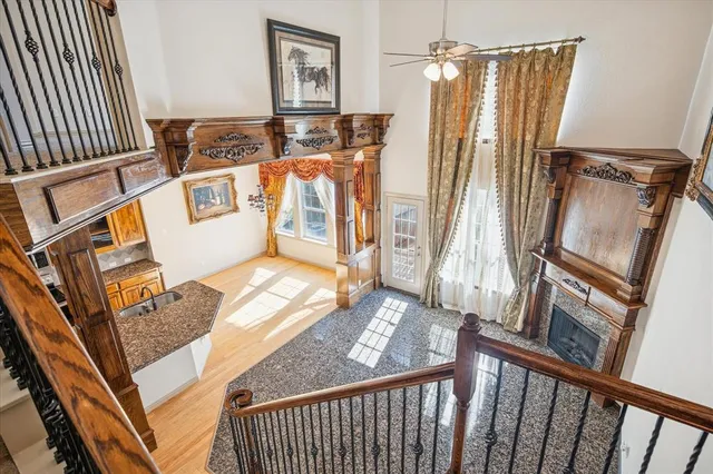 a view of a balcony with wooden floor and stairs