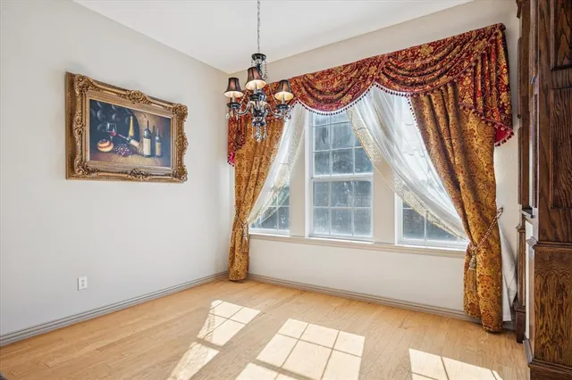 a view of a bedroom with a window and furniture