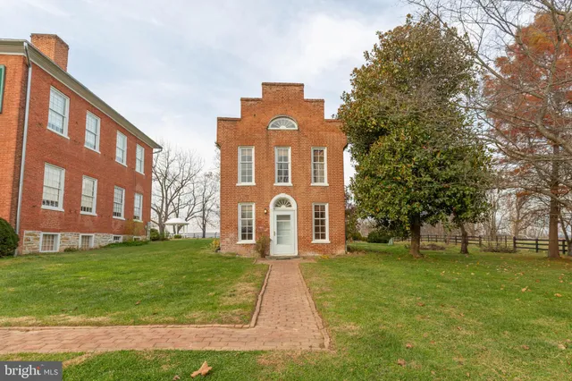 a front view of a building with garden