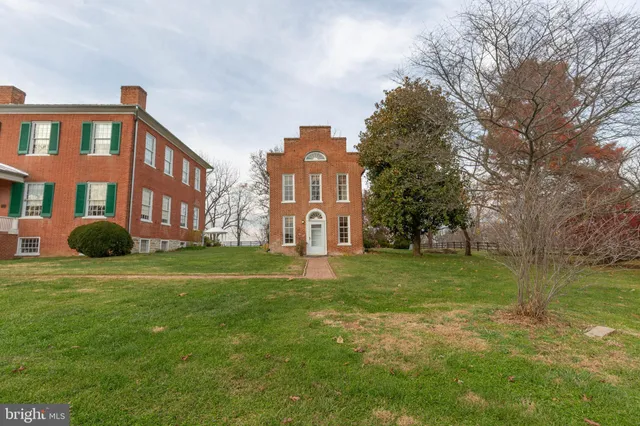 a big yard with large trees and a big yard