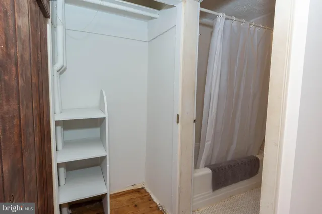 a bathroom with a glass shower door