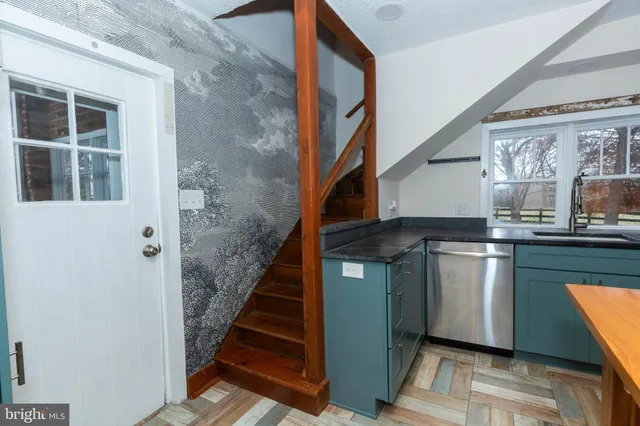 a kitchen with a stove and a sink