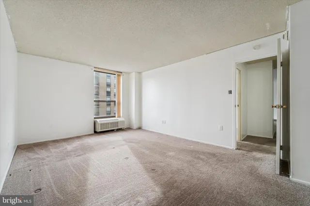 an empty room with closet area