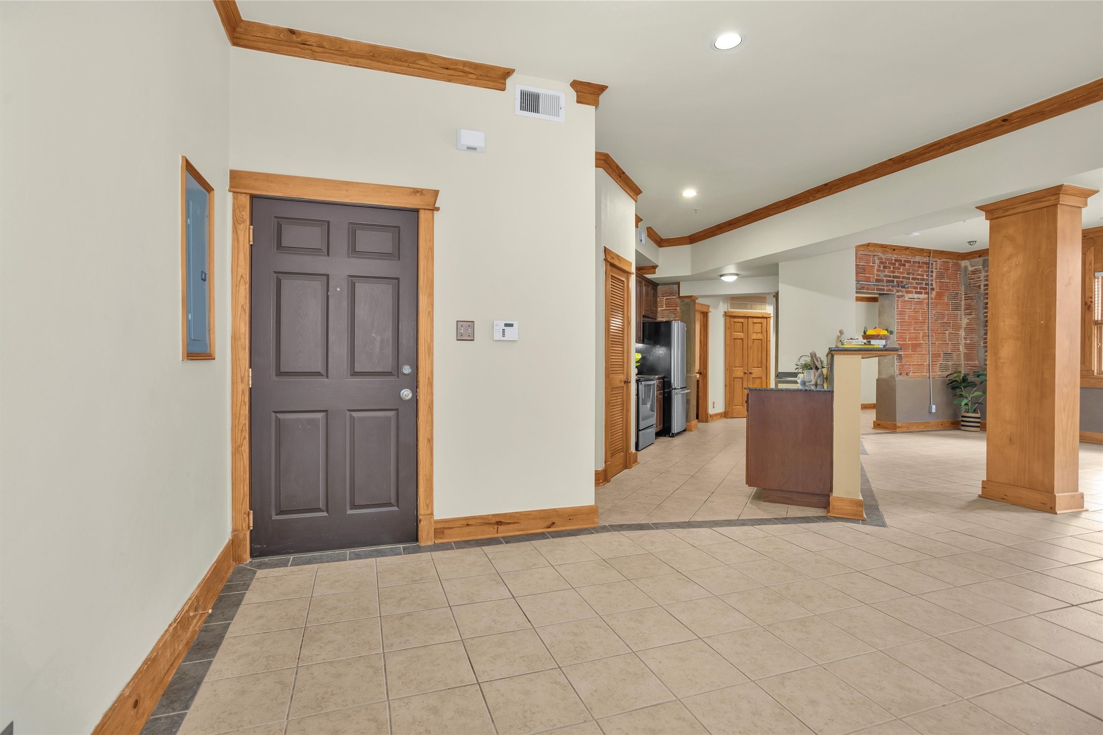 215 West Norma Street, Unit 104 Houston, TX 77009 - Photo 11 of 37 a view of a hallway with wooden shelves