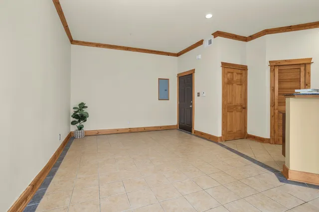 a view of an empty room with a window