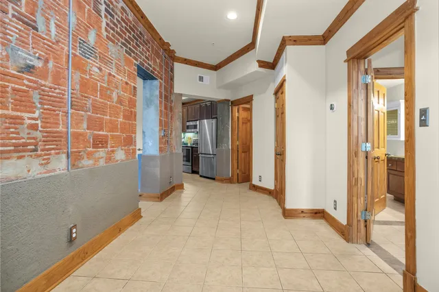 a view of a hallway with living room