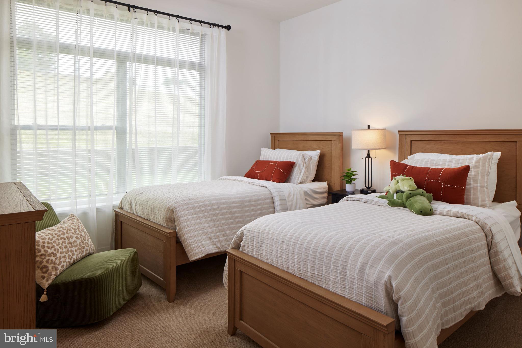 300 Furnace Street, Unit 107 Emmaus, PA 18049 - Photo 7 of 7 a bedroom with two beds and large window