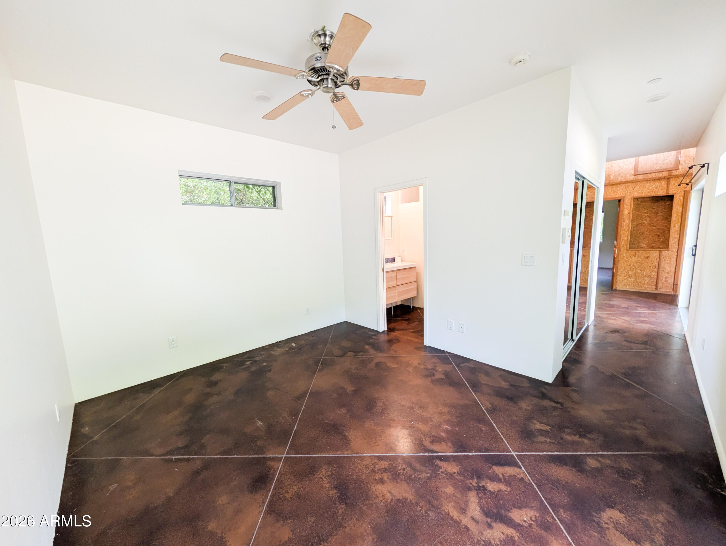 1165 North Willard Road Cottonwood, AZ 86326 - Photo 27 of 122 a view of a hallway with a chandelier