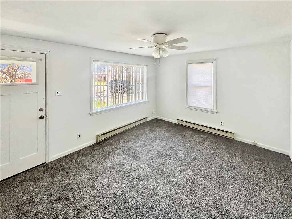 8411 Pitsburg-Laura Road Arcanum, OH 45304 - Photo 4 of 16 This bright room offers a cozy and inviting atmosphere with ample natural light.