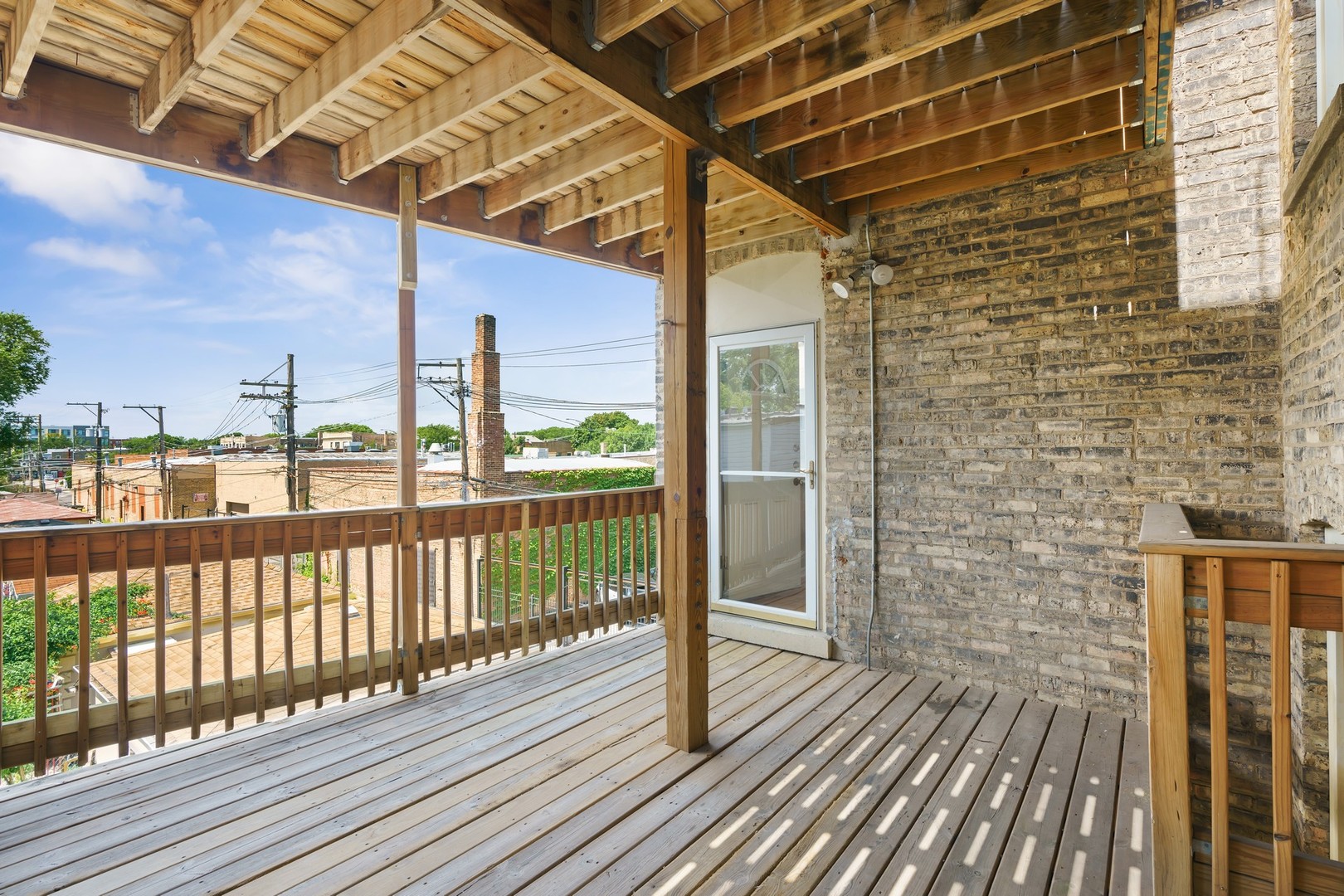 4344 North Spaulding Avenue, Unit 2 Chicago, IL 60618 - Photo 14 of 15 a view of a balcony with wooden floor