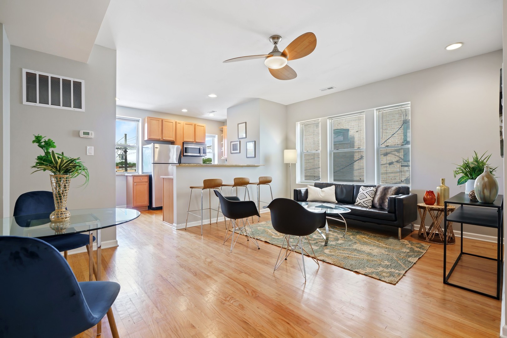 4344 North Spaulding Avenue, Unit 2 Chicago, IL 60618 - Photo 4 of 15 a living room with furniture and a chandelier