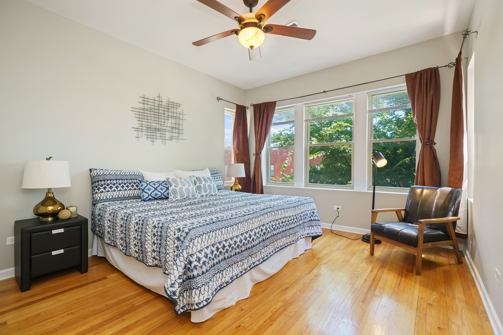4344 North Spaulding Avenue, Unit 2 Chicago, IL 60618 - Photo 10 of 15 a bedroom with a bed and a couch