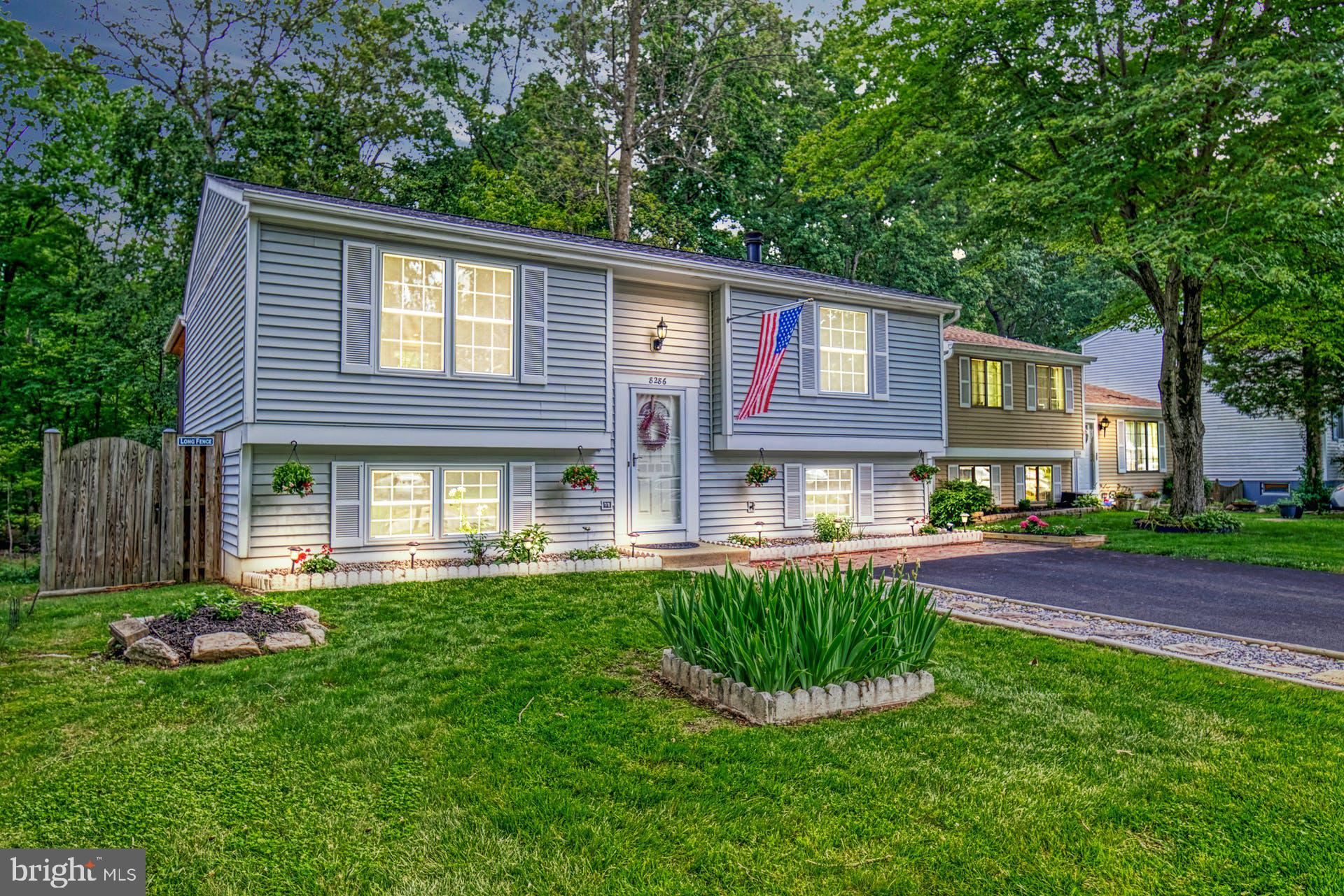8286 Raindrop Way Springfield, VA 22153 - Photo 2 of 40 Front of home in evening
