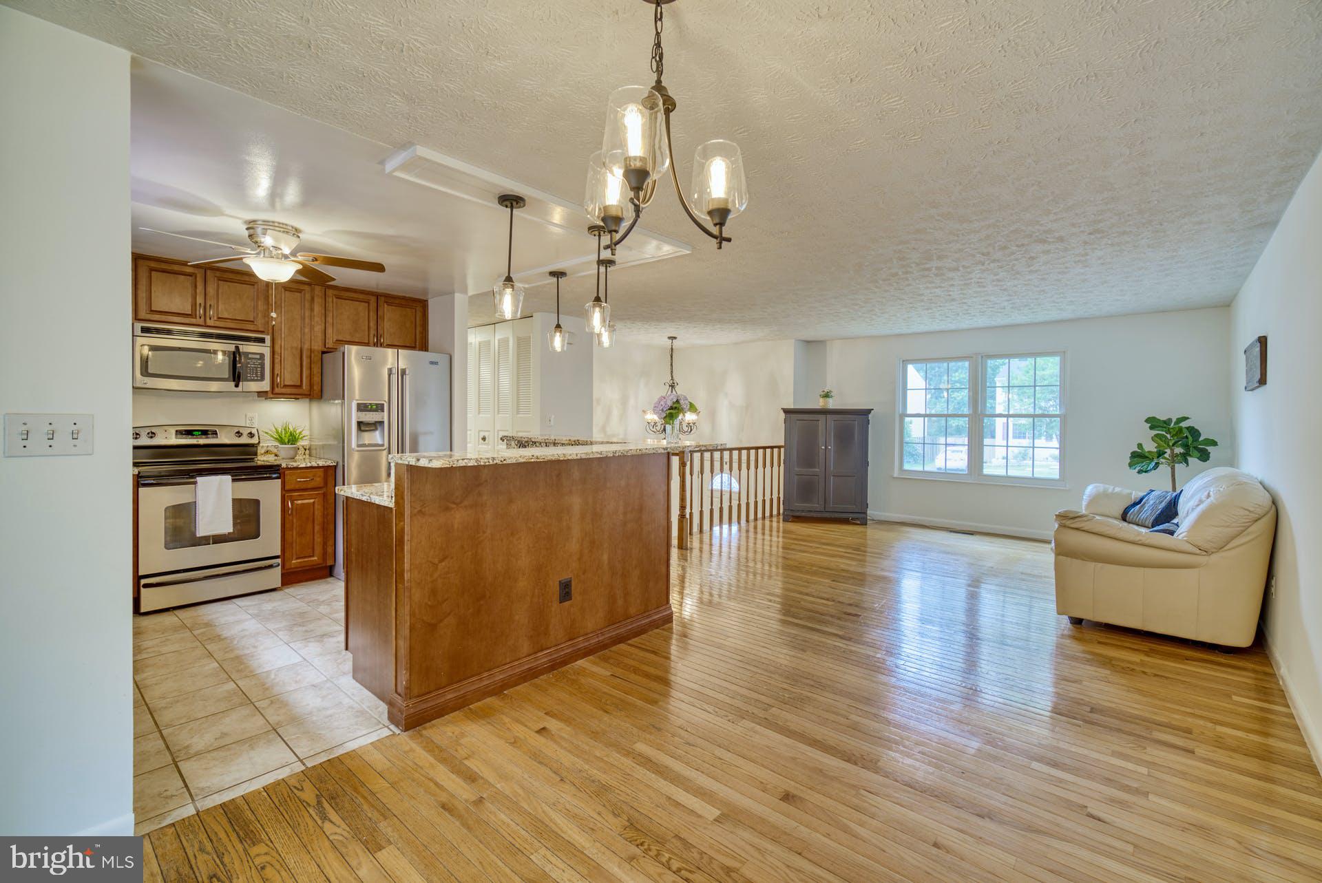 8286 Raindrop Way Springfield, VA 22153 - Photo 10 of 40 Kitchen and Living Room From Dining Area