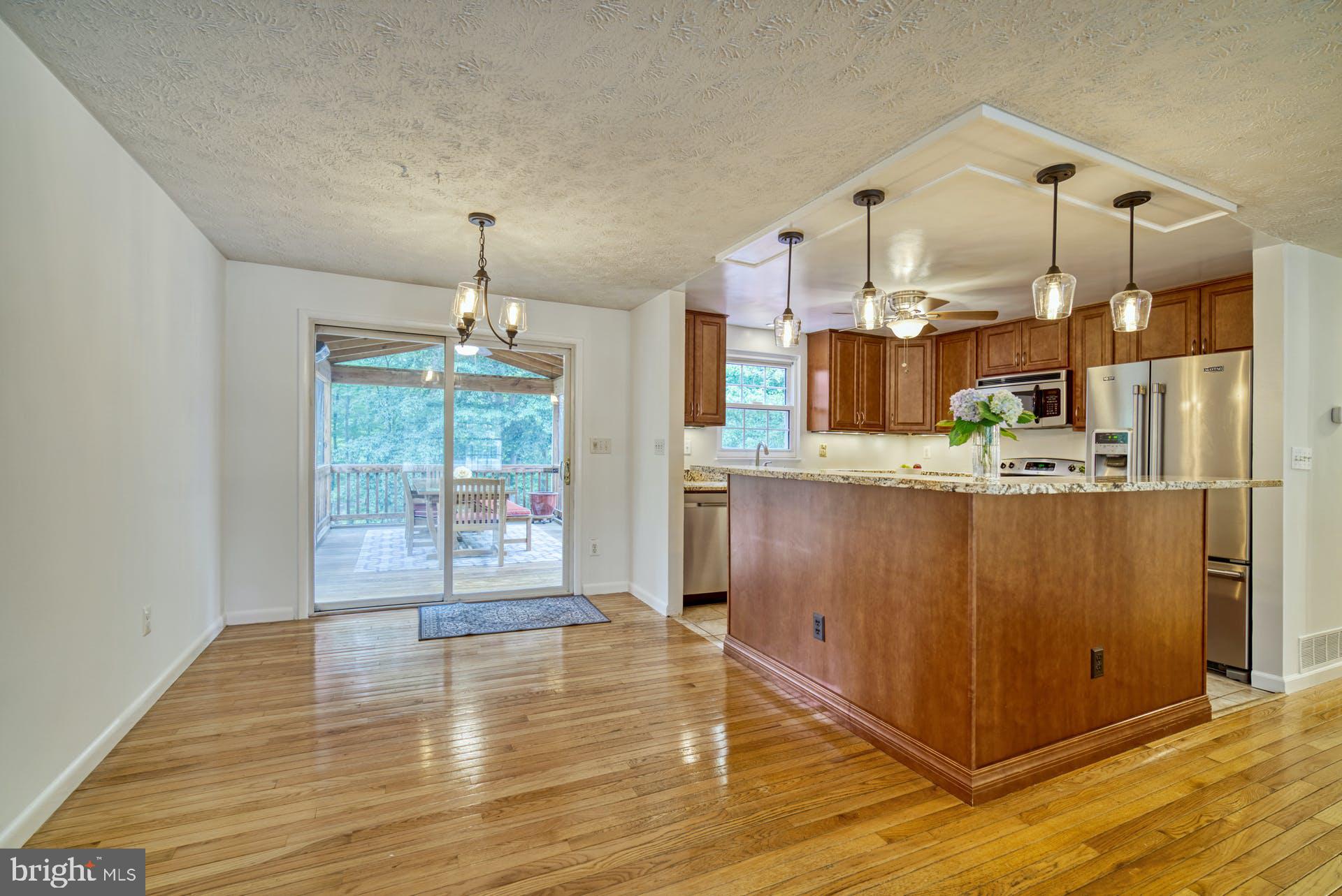 8286 Raindrop Way Springfield, VA 22153 - Photo 8 of 40 Kitchen Island/Dining Room