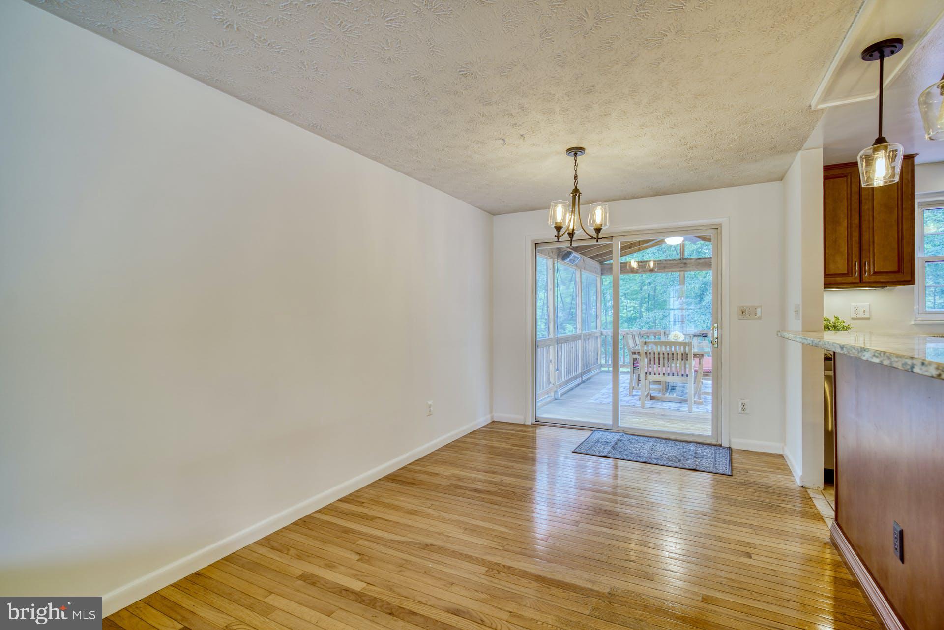 8286 Raindrop Way Springfield, VA 22153 - Photo 9 of 40 Dining Room with Door to Screened-In Porch