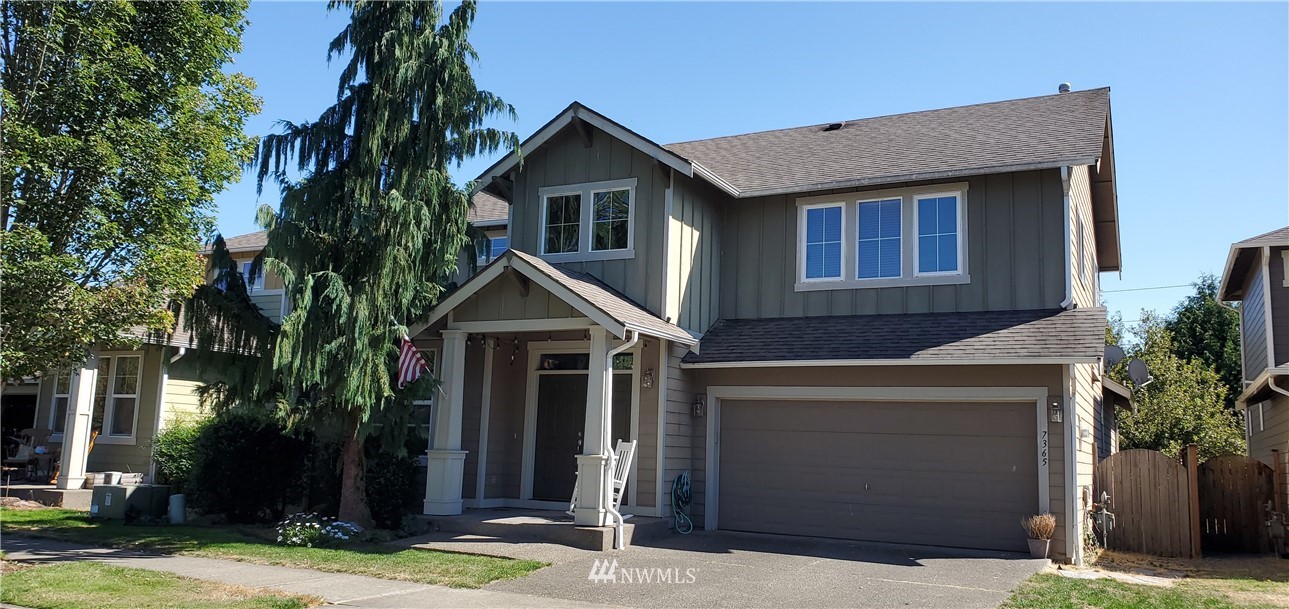 7365 Radius Loop Southeast Lacey, WA 98513 - Photo 1 of 28 a front view of a house with a yard