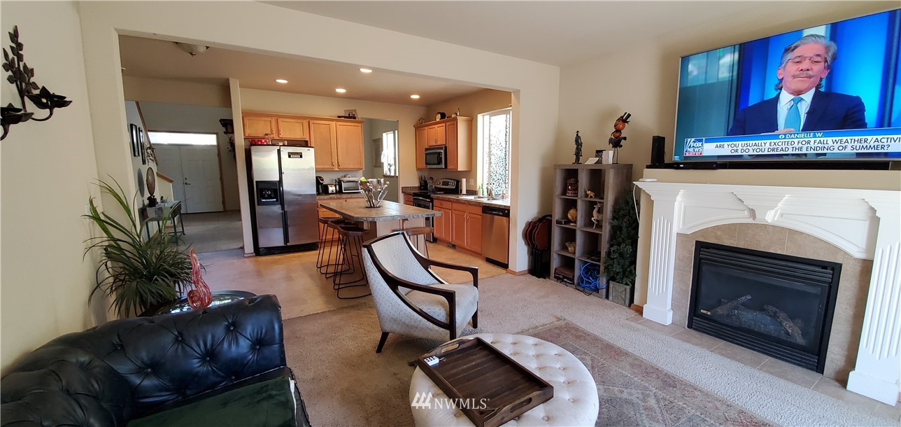 7365 Radius Loop Southeast Lacey, WA 98513 - Photo 11 of 28 a living room with furniture and a fireplace