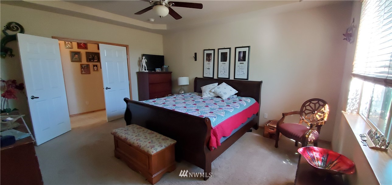 7365 Radius Loop Southeast Lacey, WA 98513 - Photo 16 of 28 a living room with furniture and a flat screen tv