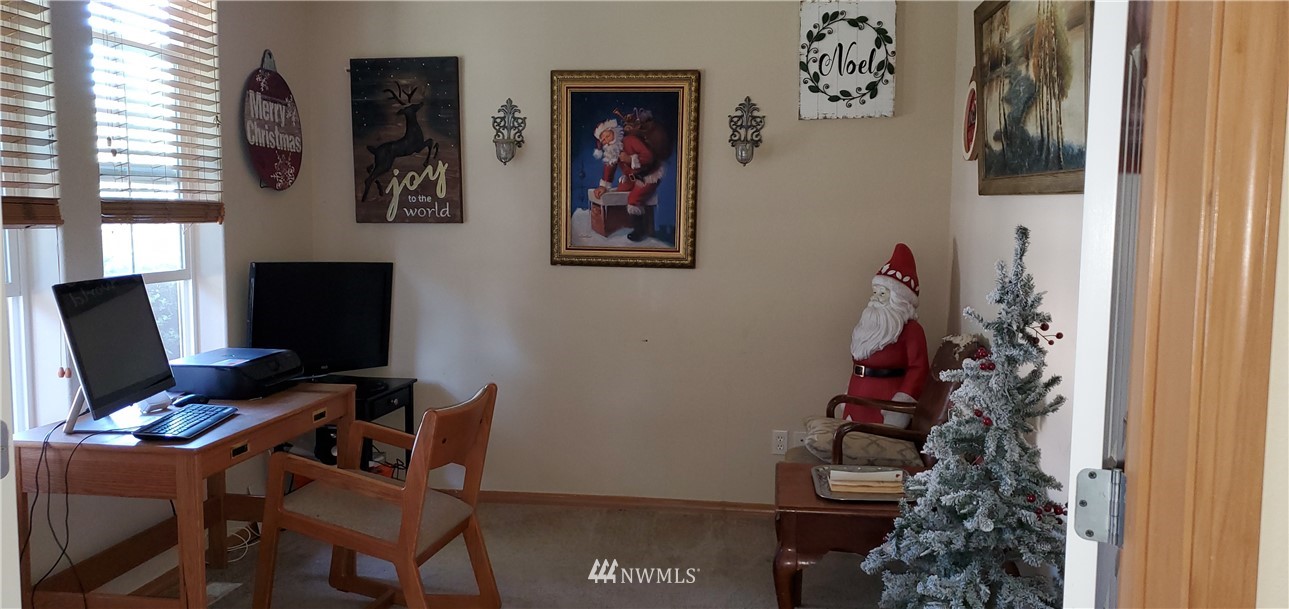 7365 Radius Loop Southeast Lacey, WA 98513 - Photo 3 of 28 a view of a workspace with furniture and a window
