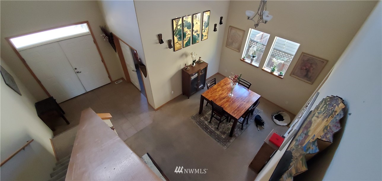7365 Radius Loop Southeast Lacey, WA 98513 - Photo 26 of 28 a living room with furniture and a flat screen tv