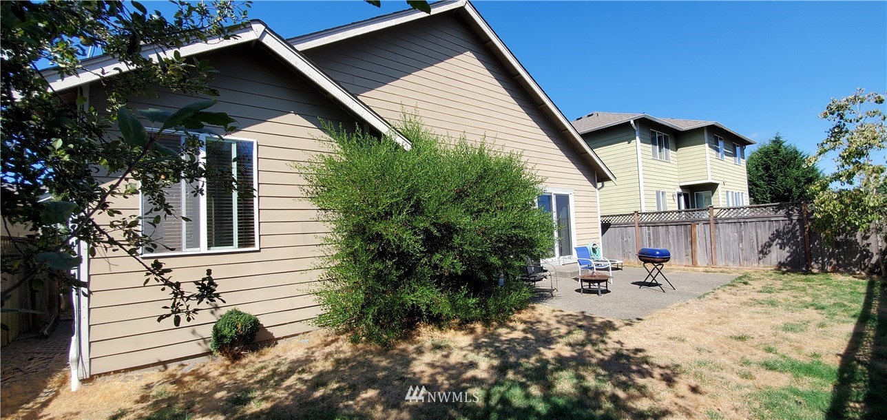7365 Radius Loop Southeast Lacey, WA 98513 - Photo 28 of 28 a front view of a house with garden
