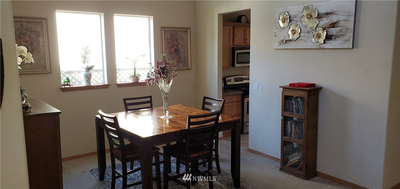 7365 Radius Loop Southeast Lacey, WA 98513 - Photo 4 of 28 a view of a dining room with furniture and window
