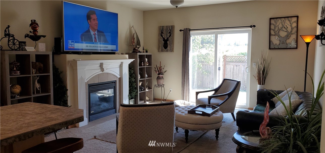 7365 Radius Loop Southeast Lacey, WA 98513 - Photo 8 of 28 a living room with furniture a rug and a window