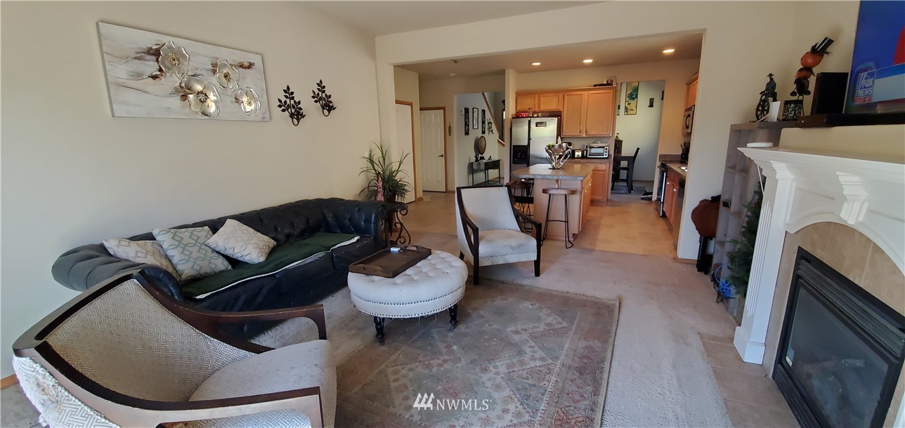 7365 Radius Loop Southeast Lacey, WA 98513 - Photo 10 of 28 a living room with furniture and a fireplace