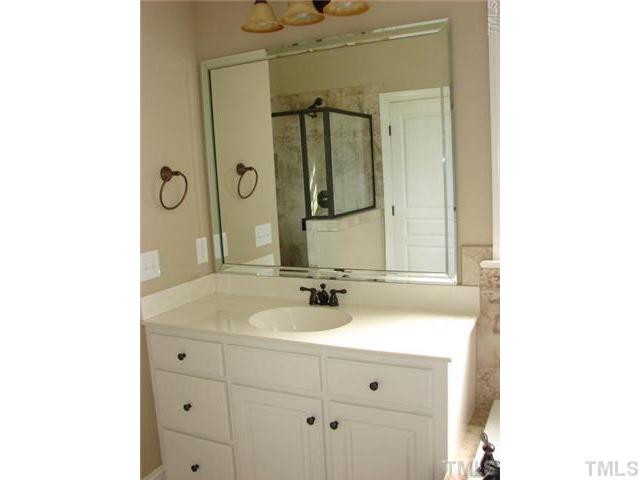 1137 Wakefield Farm Road Zebulon, NC 27597 - Photo 8 of 10 Restful master bath - custom vanities with separate shower and whirlpool tub.