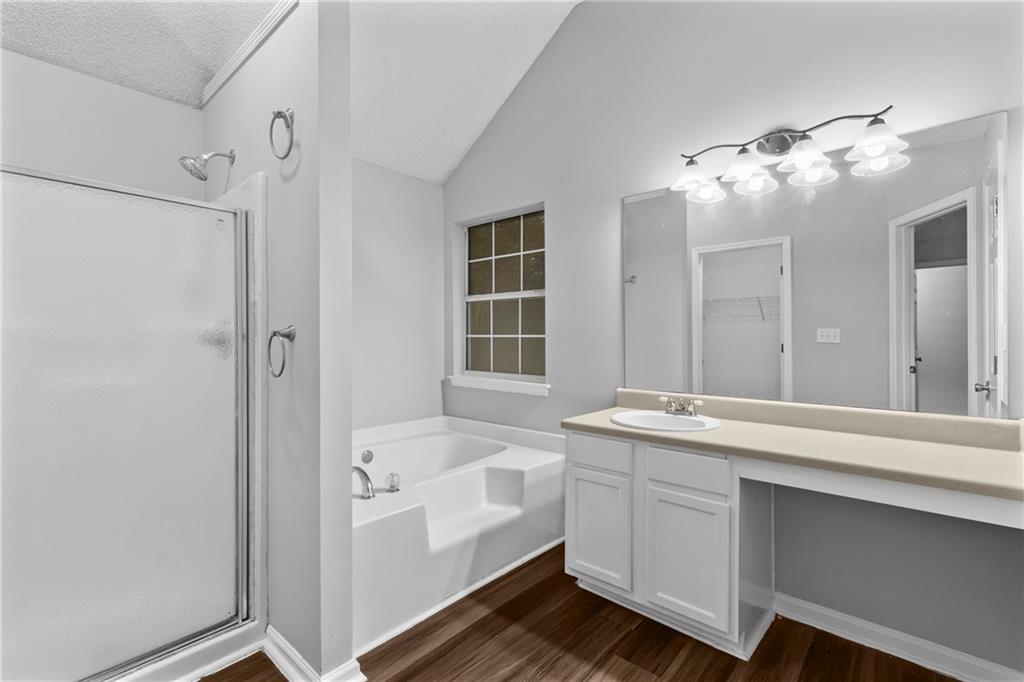 498 Pecan Wood Circle Fairburn, GA 30213 - Photo 17 of 27 a bathroom with a double vanity sink mirror and shower