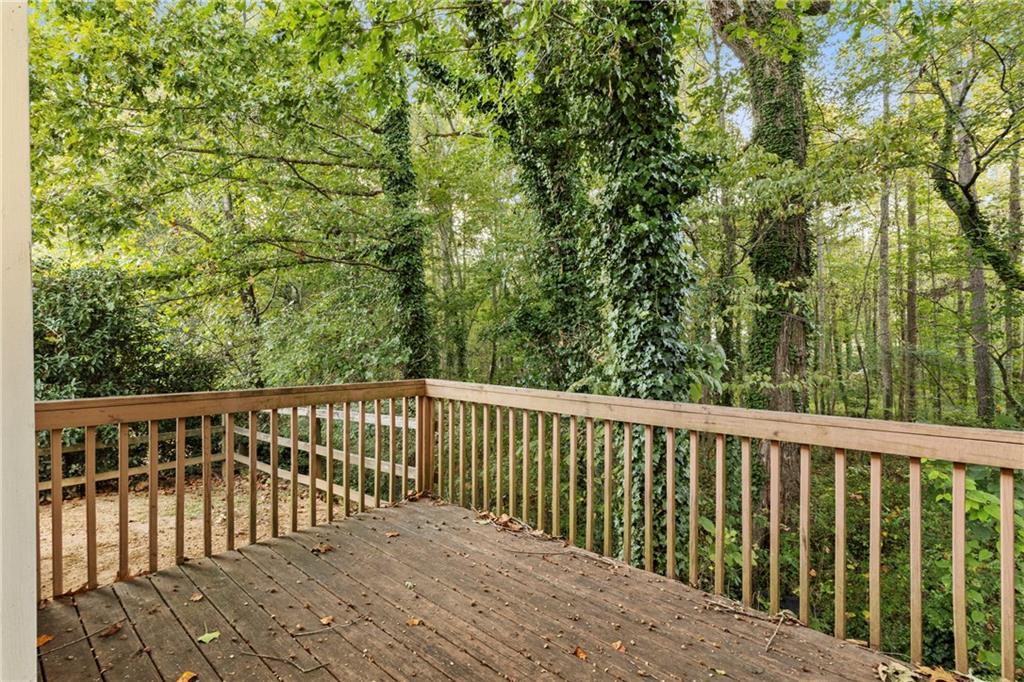 498 Pecan Wood Circle Fairburn, GA 30213 - Photo 23 of 27 a balcony with wooden floor and fence
