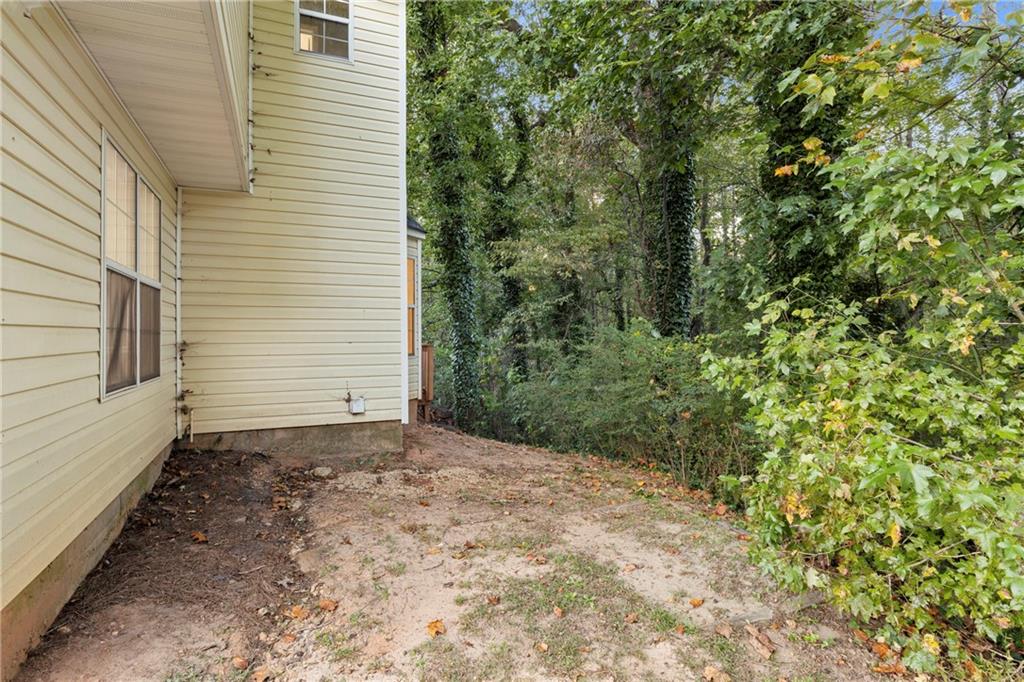 498 Pecan Wood Circle Fairburn, GA 30213 - Photo 26 of 27 a view of a backyard of a house