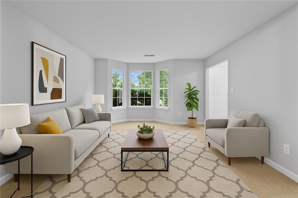 498 Pecan Wood Circle Fairburn, GA 30213 - Photo 4 of 27 a living room with furniture and a potted plant