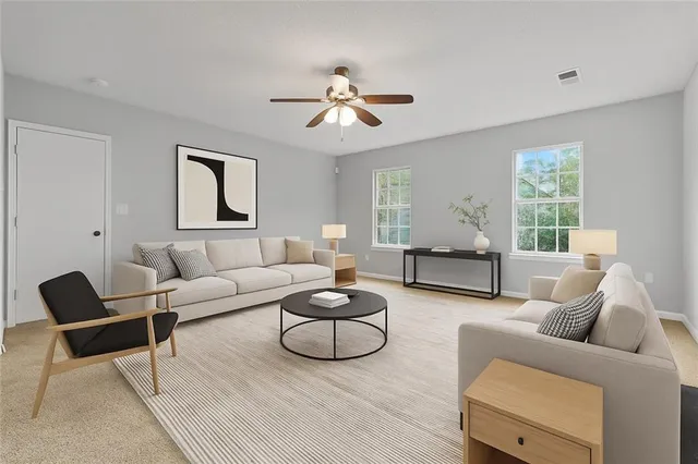 a living room with furniture or couch and a window