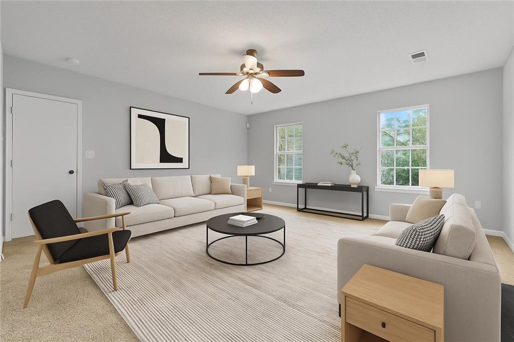 498 Pecan Wood Circle Fairburn, GA 30213 - Photo 6 of 27 a living room with furniture or couch and a window