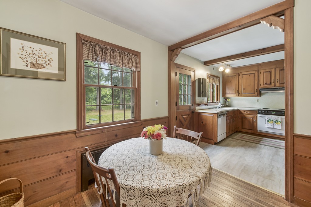 11 Forrest Road Topsfield, MA 01983 - Photo 12 of 30 a living room with dining table and chairs