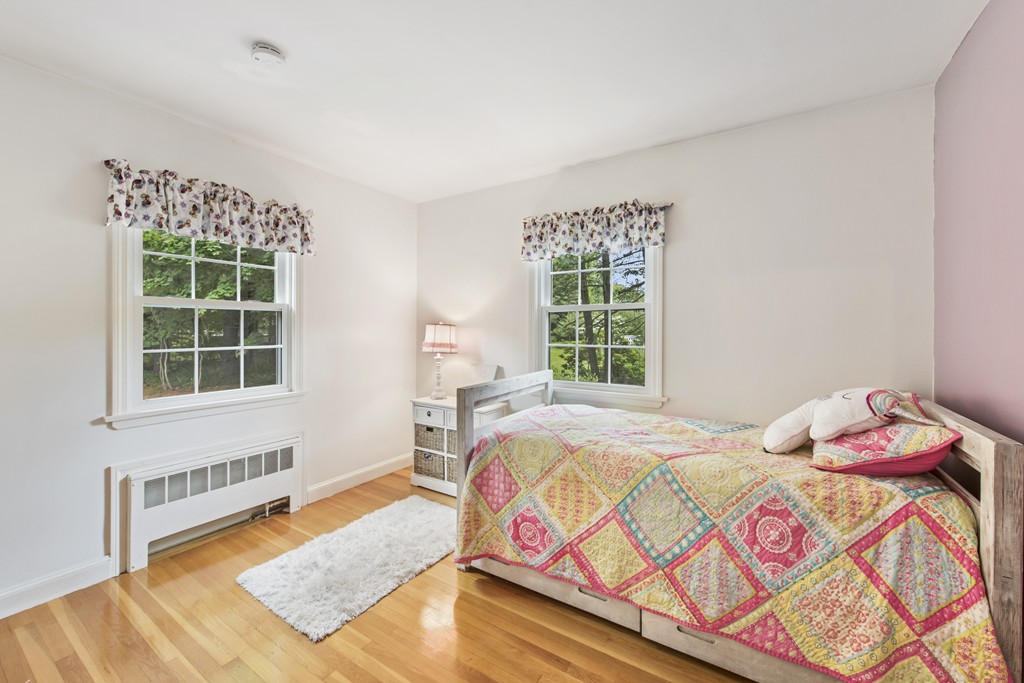 11 Forrest Road Topsfield, MA 01983 - Photo 19 of 30 a bedroom with a bed and a window