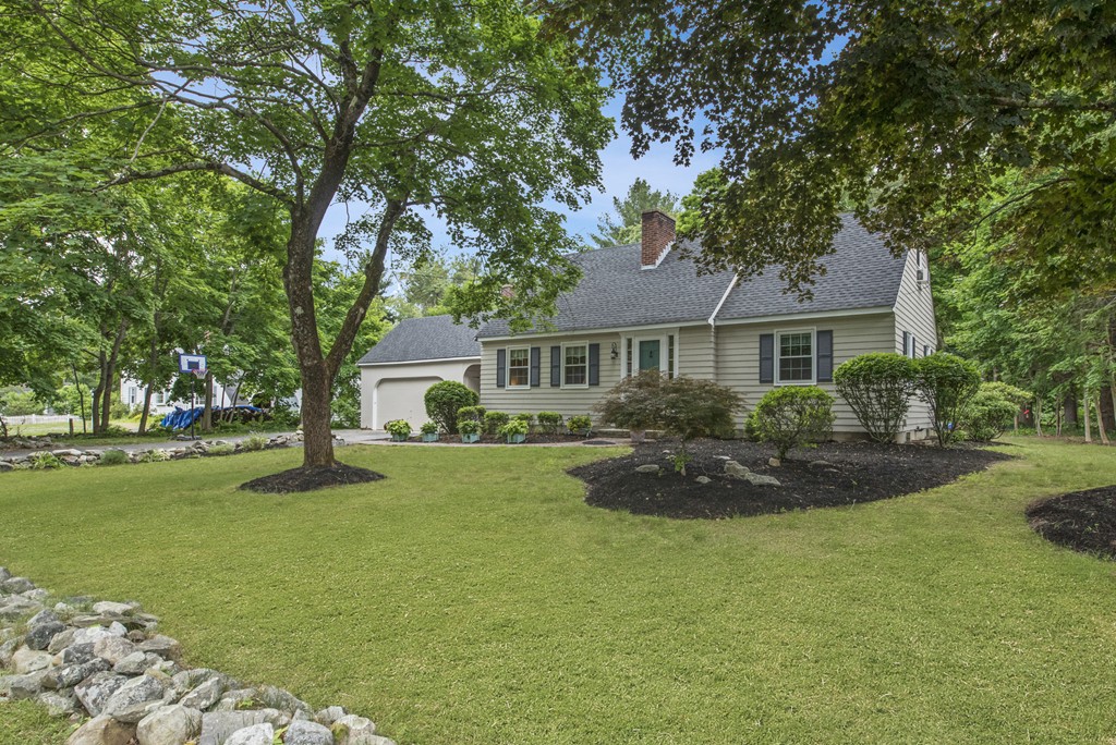 11 Forrest Road Topsfield, MA 01983 - Photo 2 of 30 a front view of a house with garden