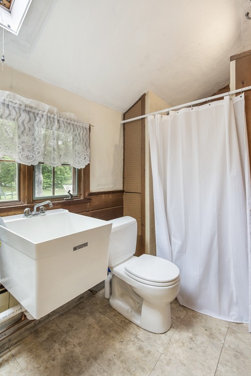 11 Forrest Road Topsfield, MA 01983 - Photo 25 of 30 a bathroom with a sink toilet and shower
