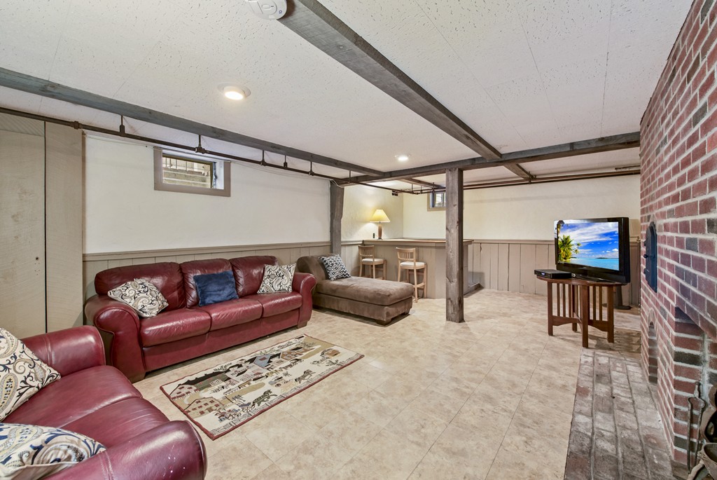 11 Forrest Road Topsfield, MA 01983 - Photo 26 of 30 a living room with furniture and a flat screen tv