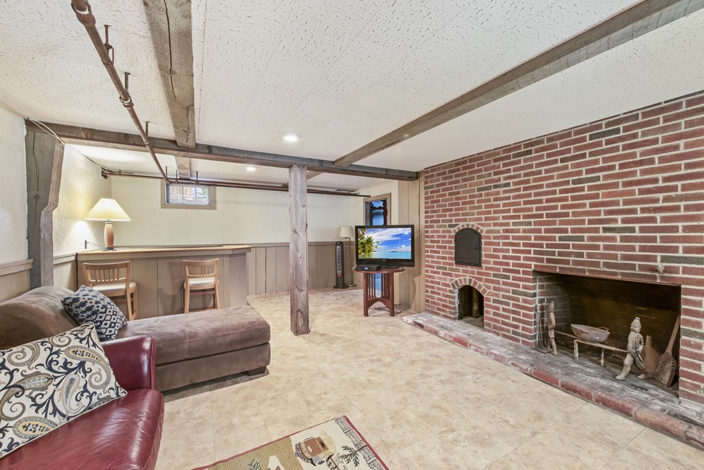 11 Forrest Road Topsfield, MA 01983 - Photo 27 of 30 a living room with furniture and a fireplace