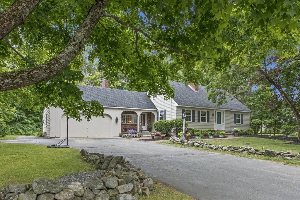 11 Forrest Road Topsfield, MA 01983 - Photo 3 of 30 a front view of a house with a garden