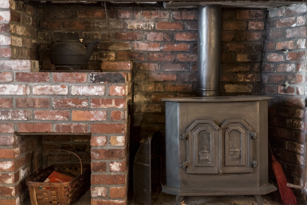 11 Forrest Road Topsfield, MA 01983 - Photo 10 of 30 a closeup of a fireplace with a sink