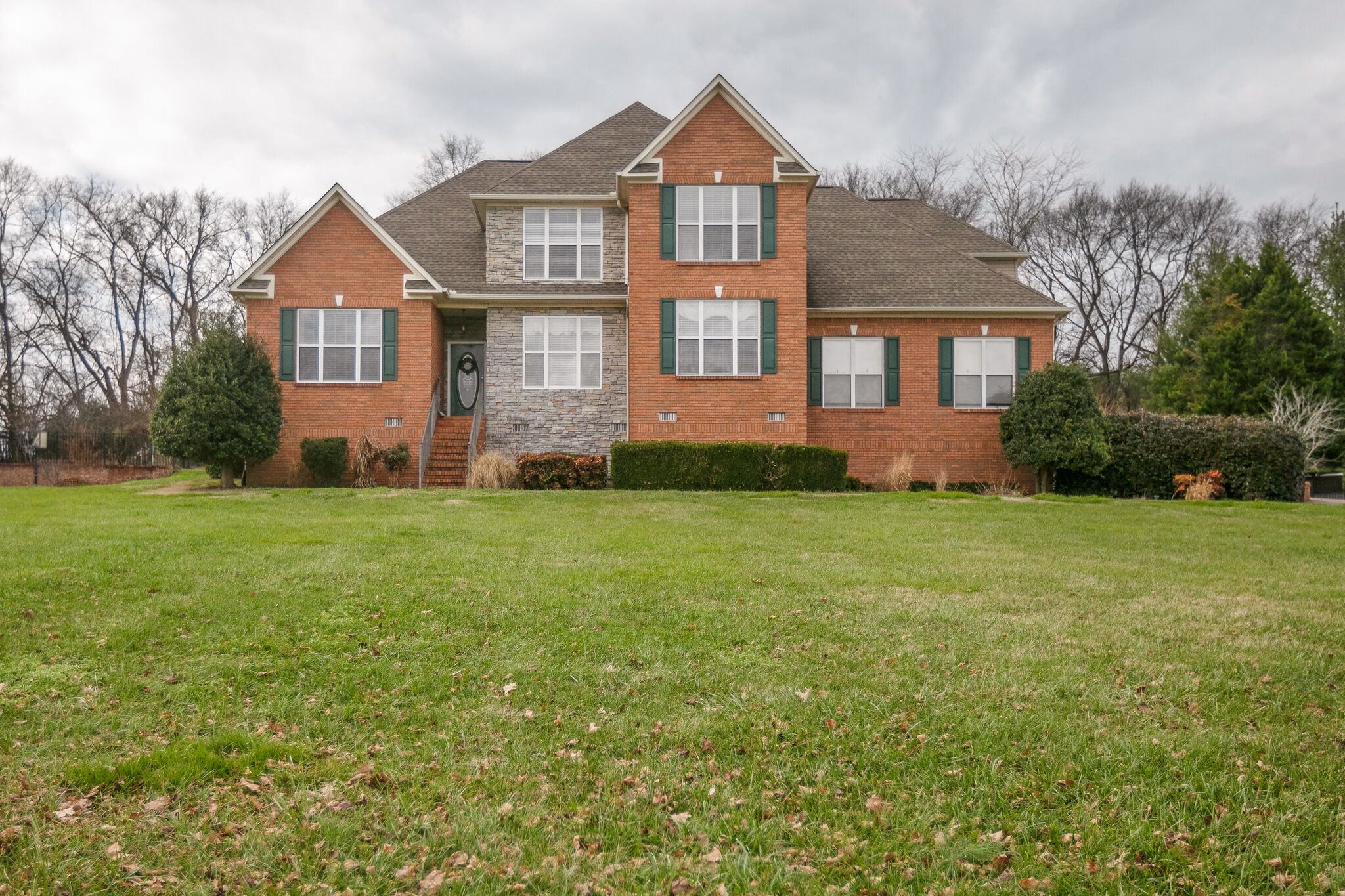 a front view of a house with a yard
